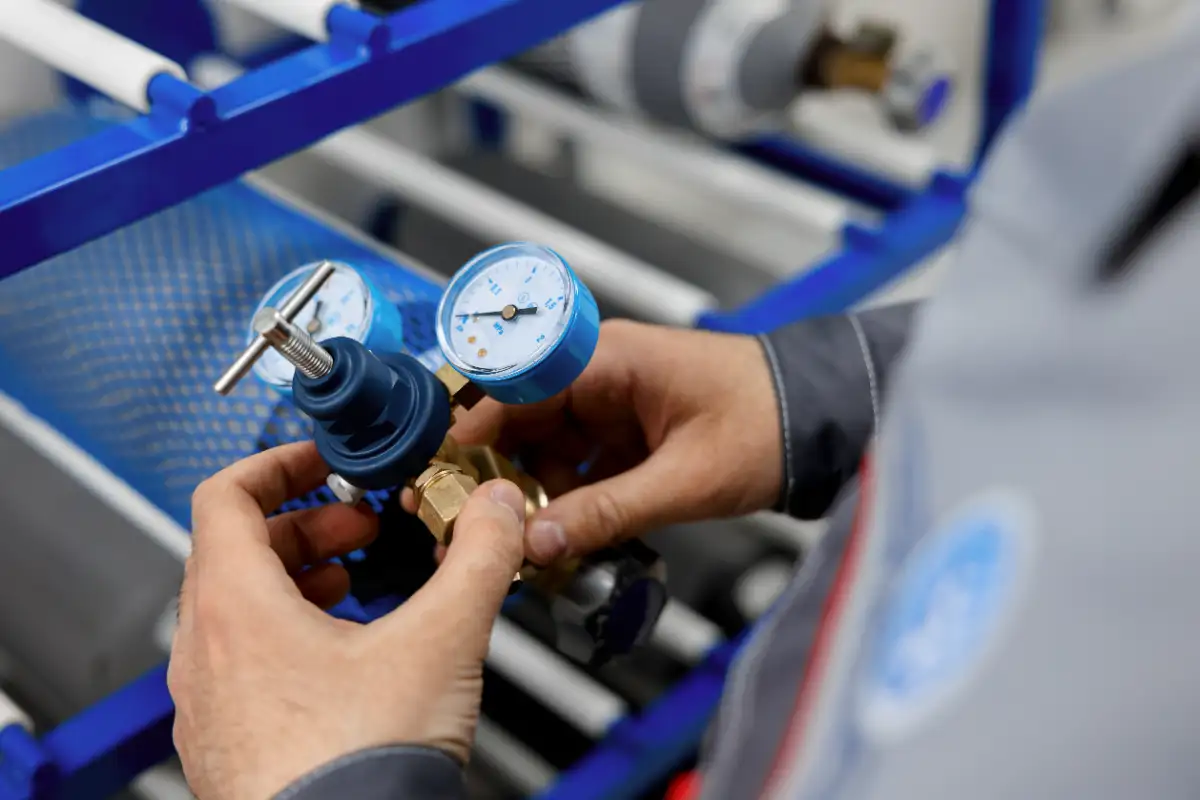 Metrology Laboratory Specialist Takes A Compressed Gas Cylinder For Testing And Verification