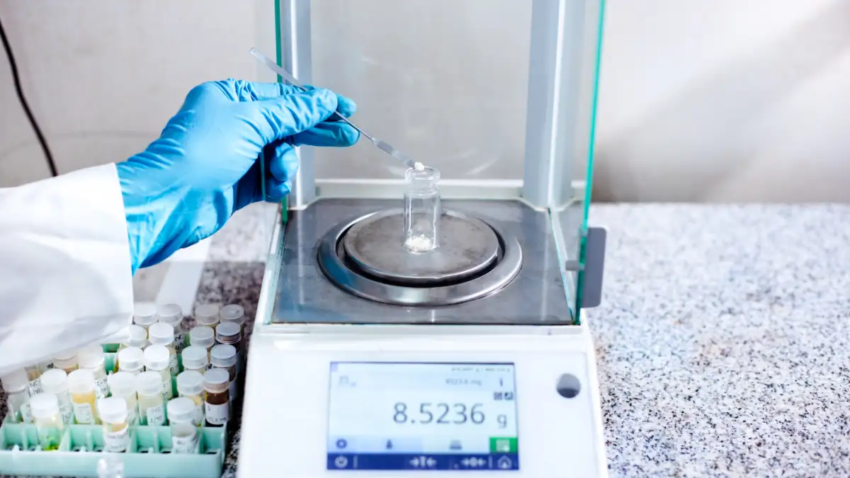 Scientist Digital Analytical Balance With 4 Digit Precision In The Laboratory